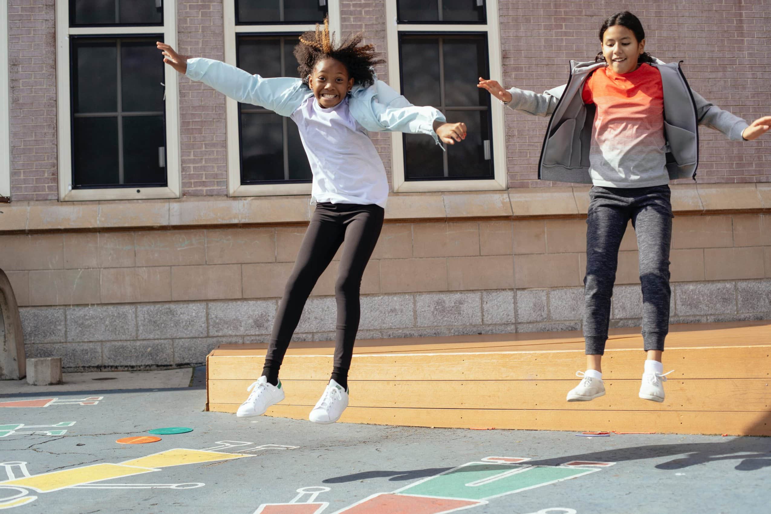 Photo by Mary Taylor: https://www.pexels.com/photo/excited-multiethnic-classmates-jumping-off-wooden-scene-located-near-school-5896812/